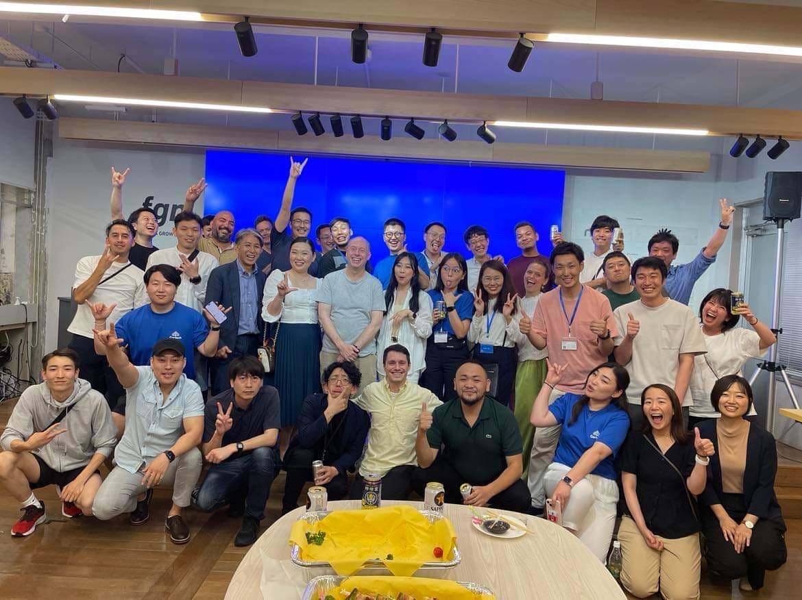 My badge on top of a pile of badges from a Vercel meetup we held